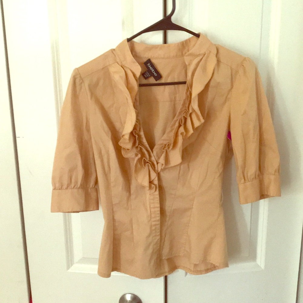 Tan shirt. Never worn and tag is still on
